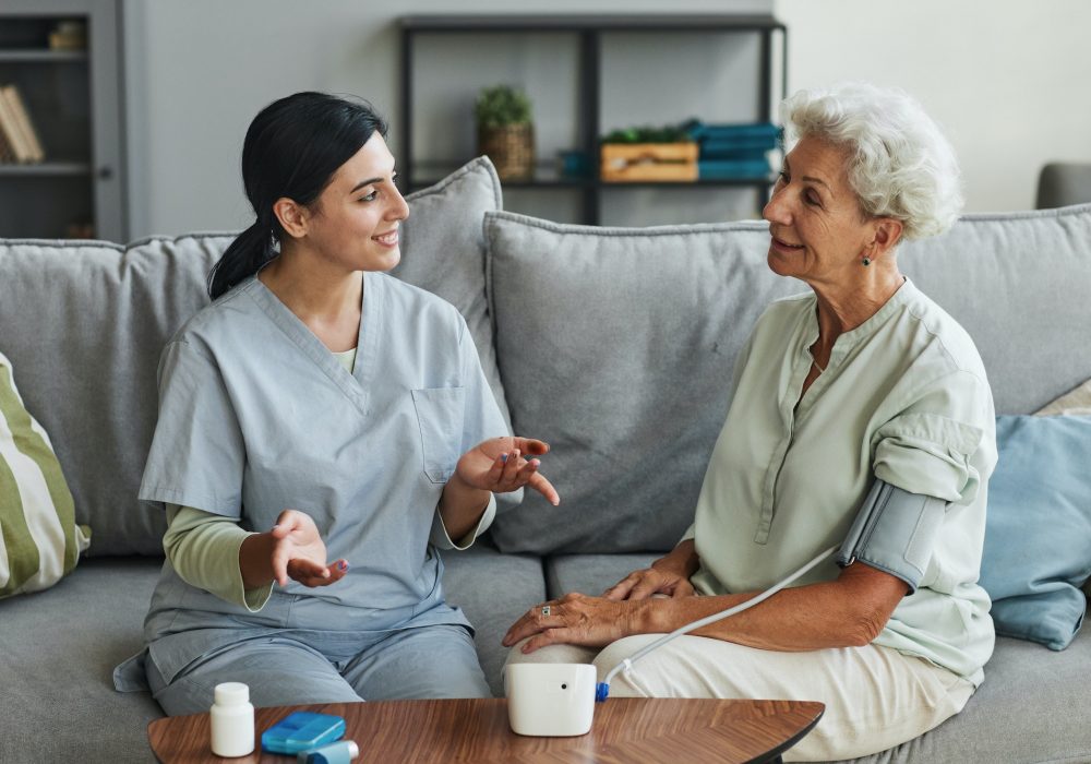 young-nurse-talking-to-senior-woman-in-retirement-home.jpg